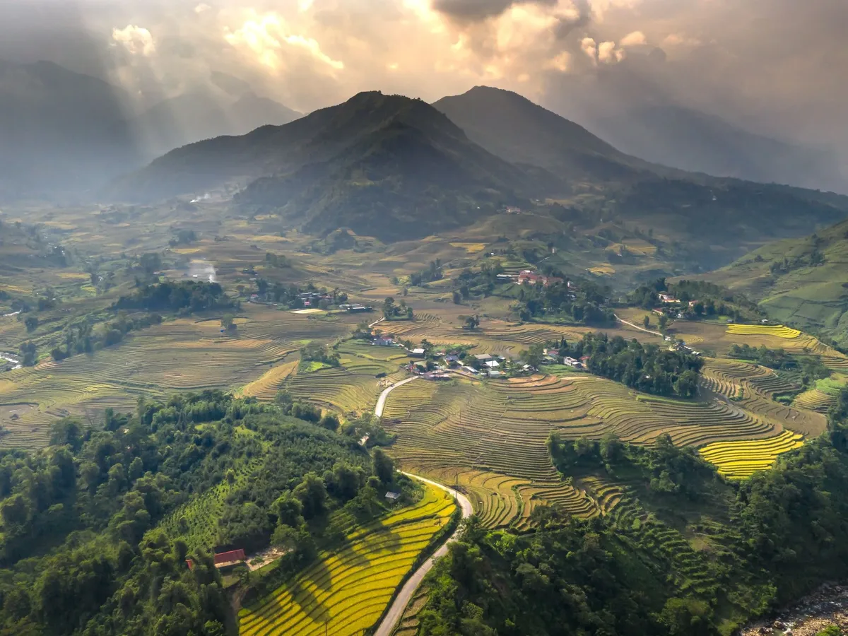 A mountainous region with a road running through it.