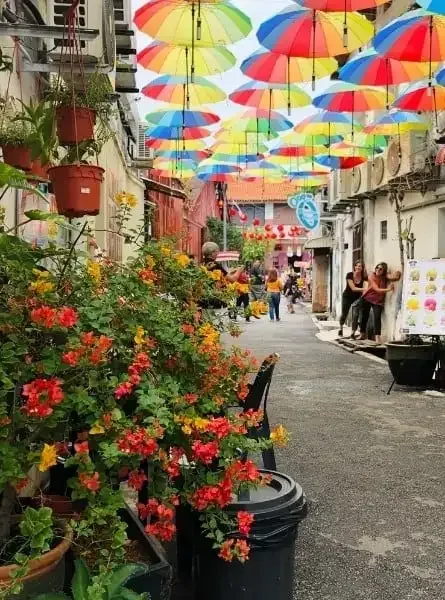 A lane hung with colourful umbrellas in George Town