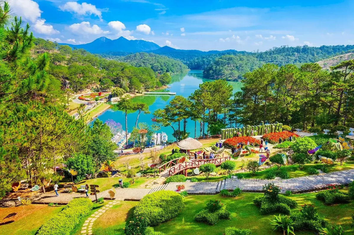 Gardens and a lake among pine-covered hills in Da Lat
