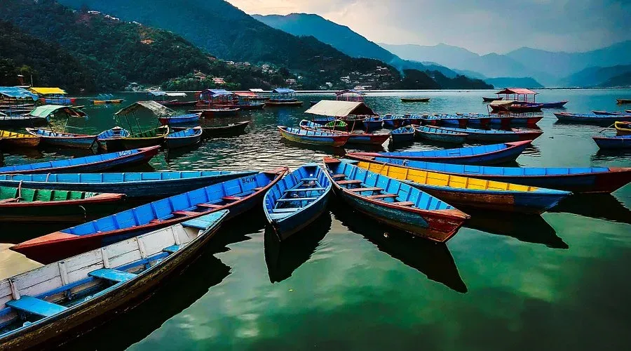 Colourful wooden boats moored on Phewa Lake in Pokhara