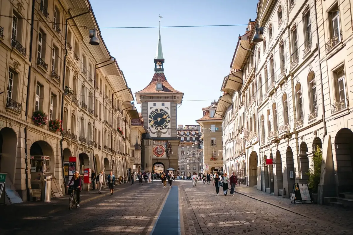 The Zytglogge clock tower at the end of an arcaded street in Bern