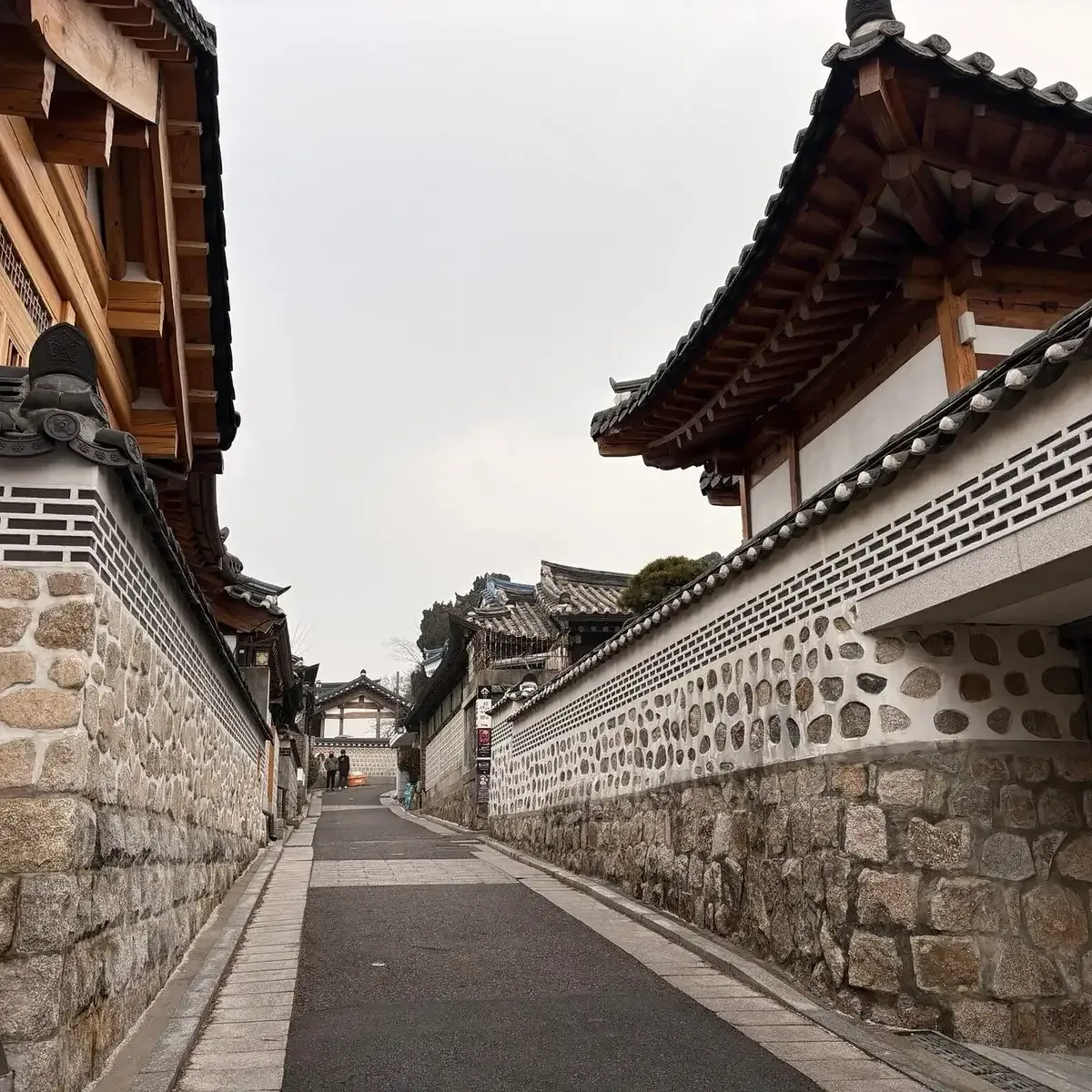 A quiet lane between traditional hanok houses in Bukchon, Seoul