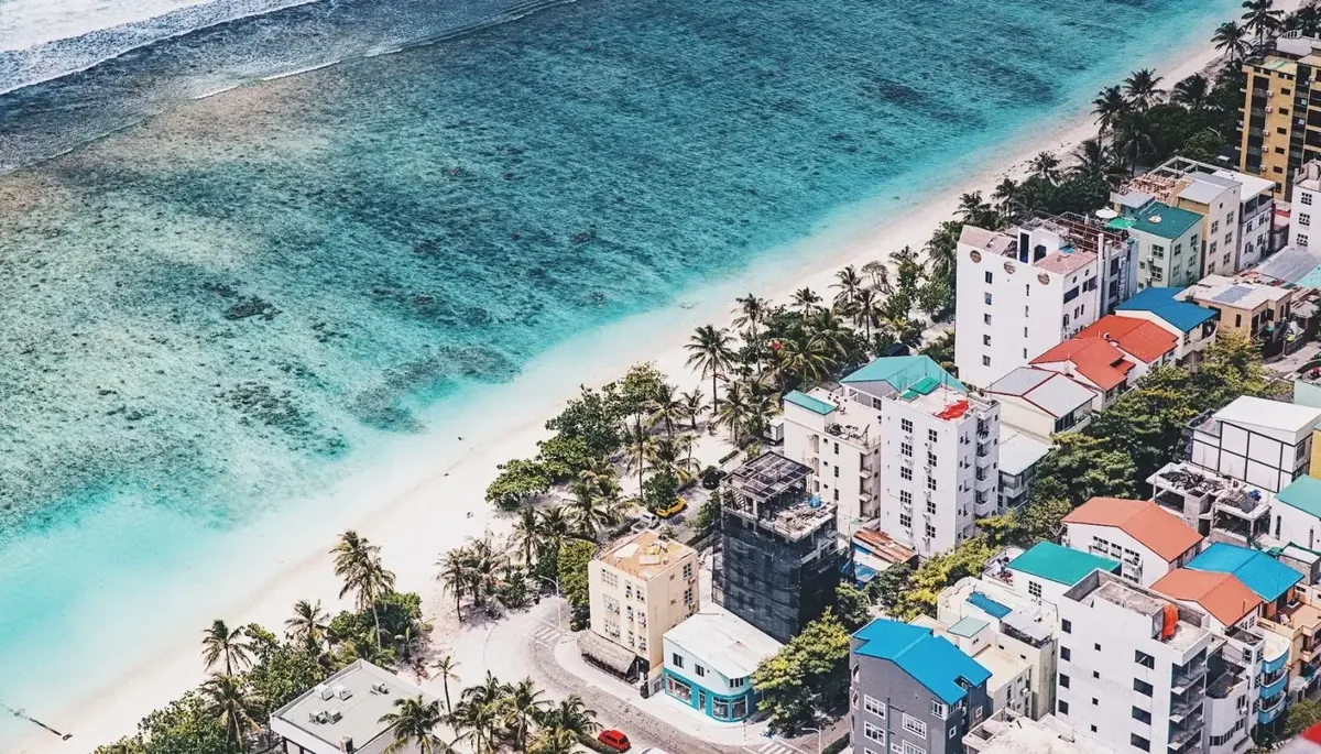 Hulhumalé beach and apartment blocks beside the lagoon, from the air