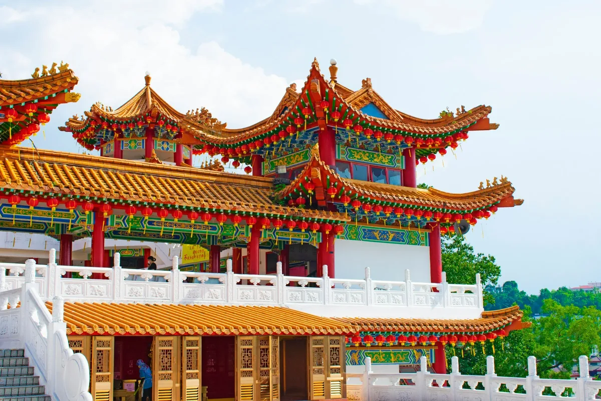 A Chinese temple with red roofs and lanterns in Malaysia