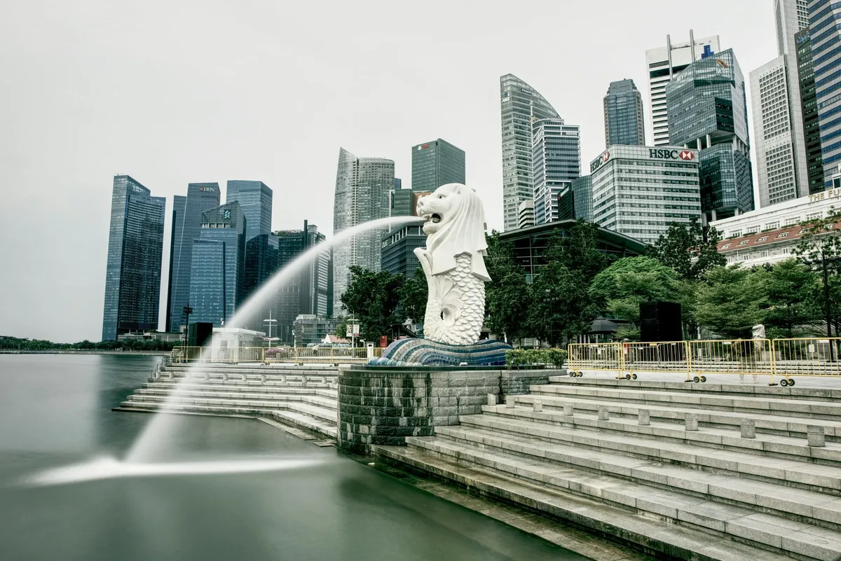 The Merlion fountain in front of the Singapore skyline