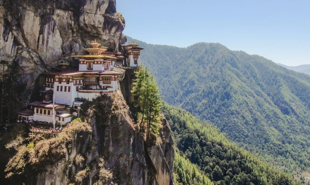 Paro Taktsang, the Tiger's Nest monastery, on a cliff above a forested valley